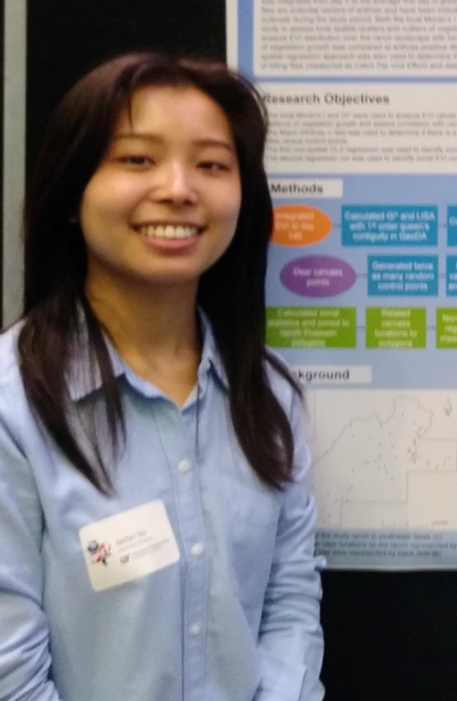 Jaclyn Siu stands near a poster.